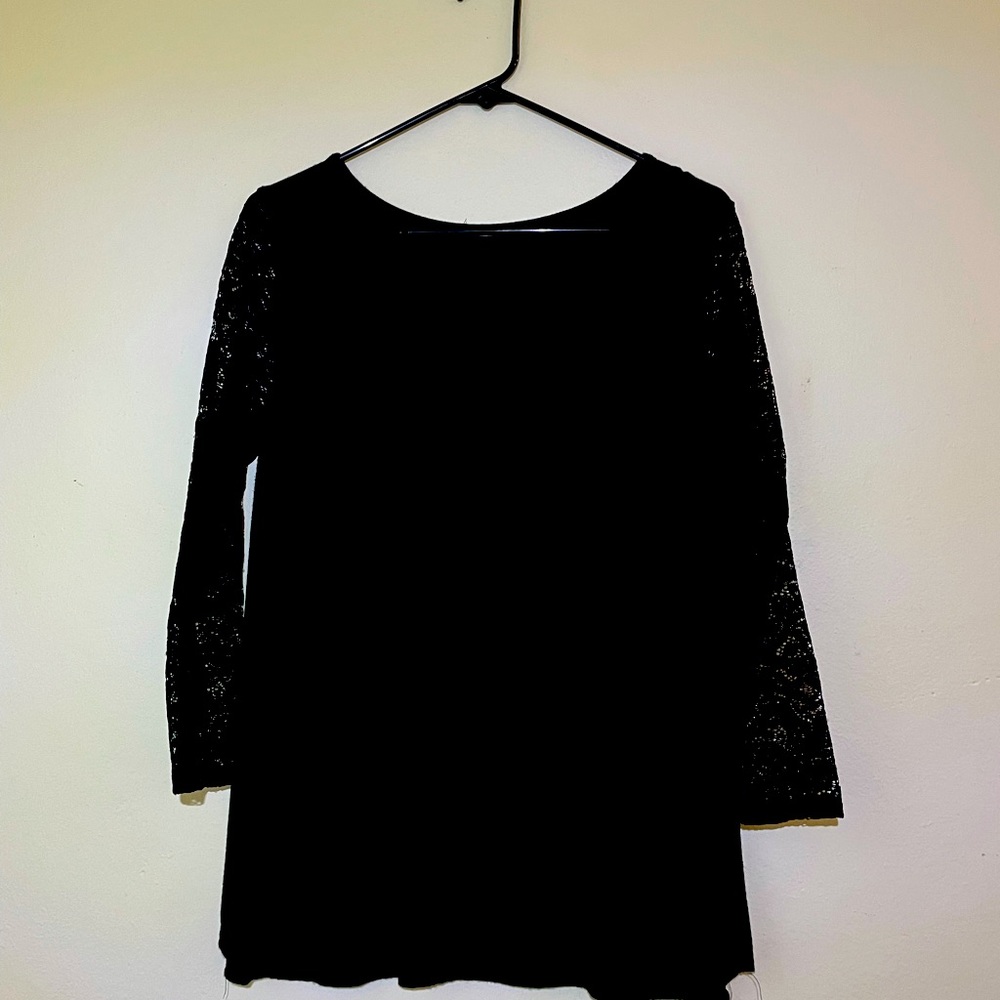 Burkett lace detail knit. Black top.